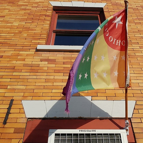 A rainbow-colored version of the Ohio City neighborhood flag.