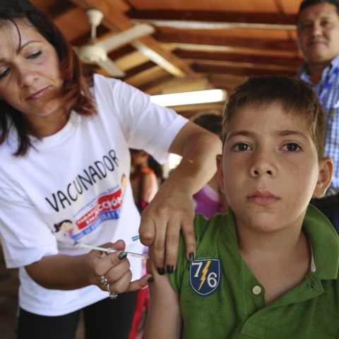 A young Paraguayan boy receives a vaccination during the 2014 'Vaccination Week In The Americas.'