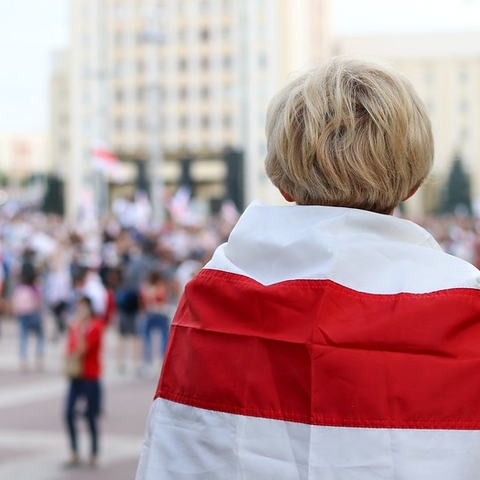 A protestor in Minsk watches the August 2020 demonstrations.