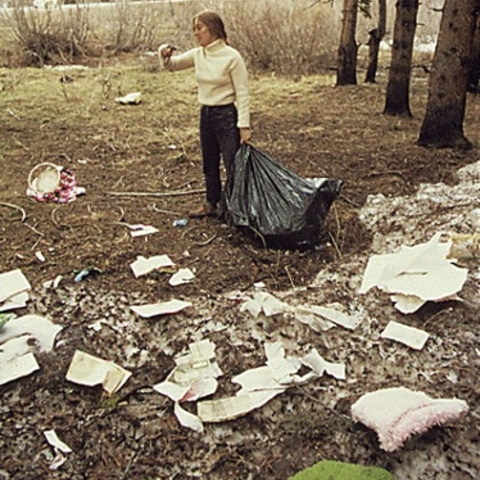 A woman picks up trash in 1972 near Vail, Colorado.