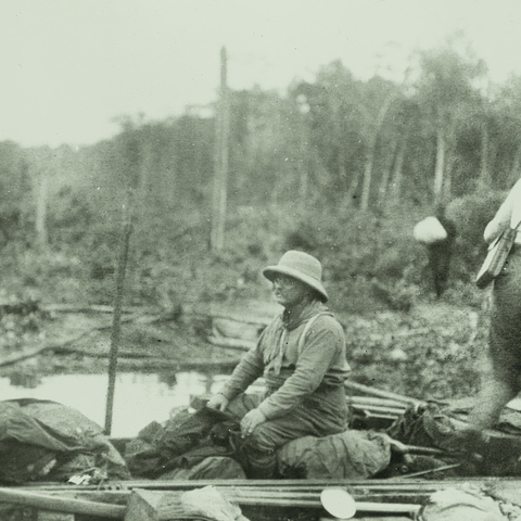 Theodore Roosevelt sitting in a boat during the 1913-1914 Rondo-Roosevelt Scientific Expedition.