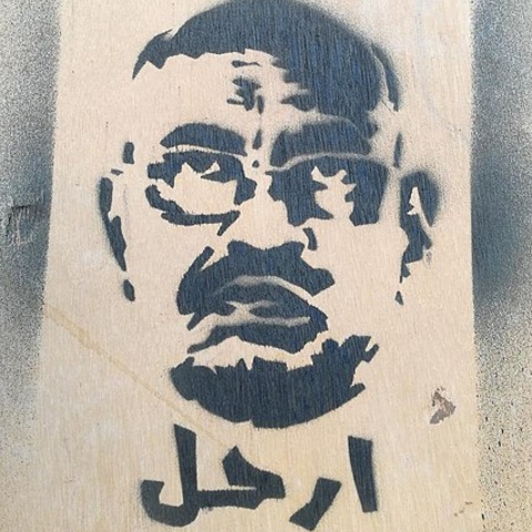 A pro-revolutionary street stencil in Khartoum seeking President Omar al-Bashir’s removal in 2018.