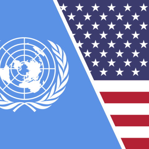 On the left, the flag of the United Nations. On the right, the flag of the United States of America.