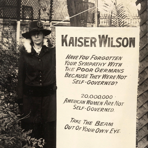 Virginia Arnold poses with the 'Kaiser Wilson' banner.