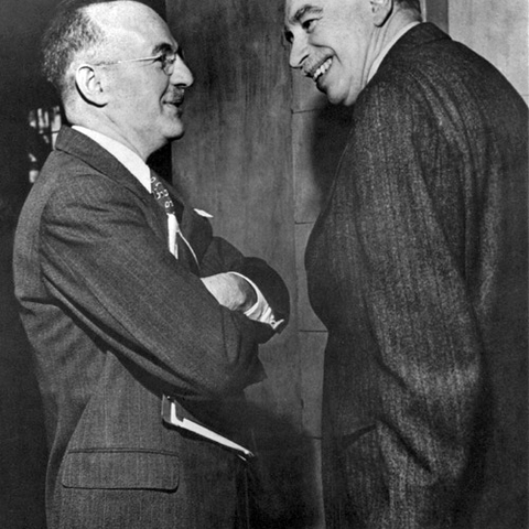 On the left, Harry Dexter White. On the right, John Maynard Keynes.