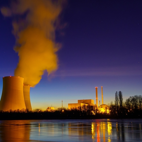 A nuclear power plant located on the Rhine at night.