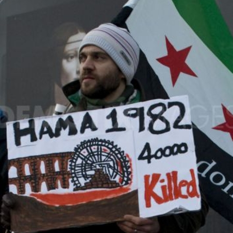 A protestor marks the 30th anniversary of the Hama massacre in 2012.